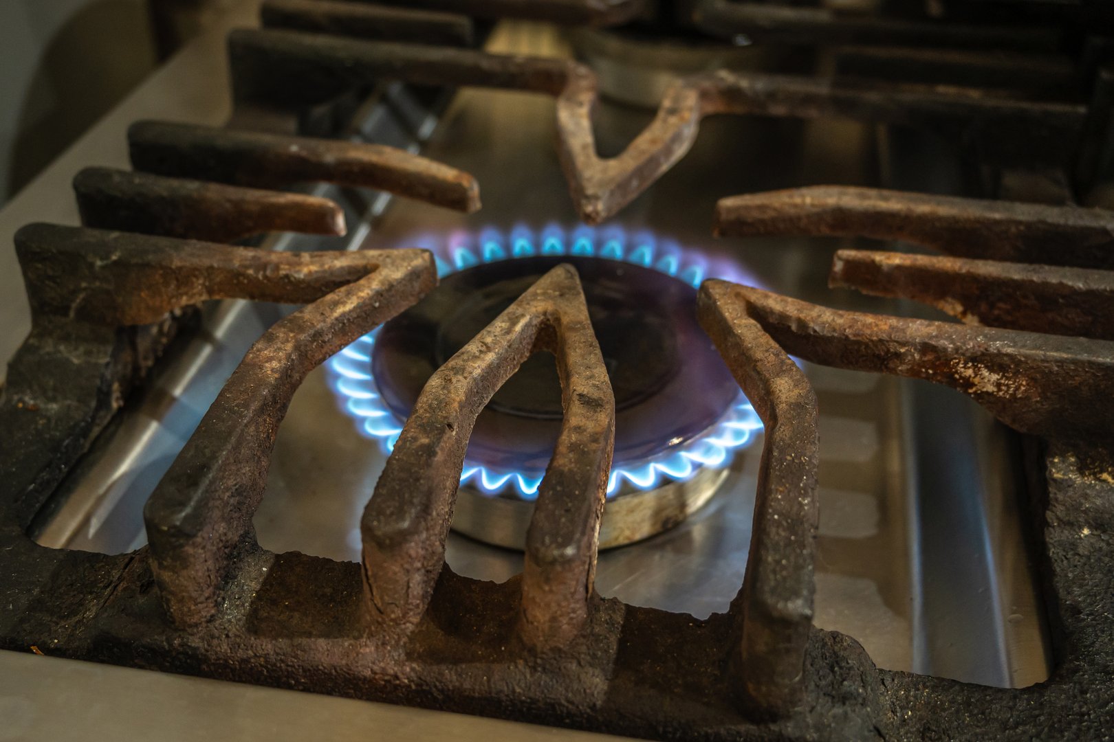 Natural gas stove on. Gas consumption concept.