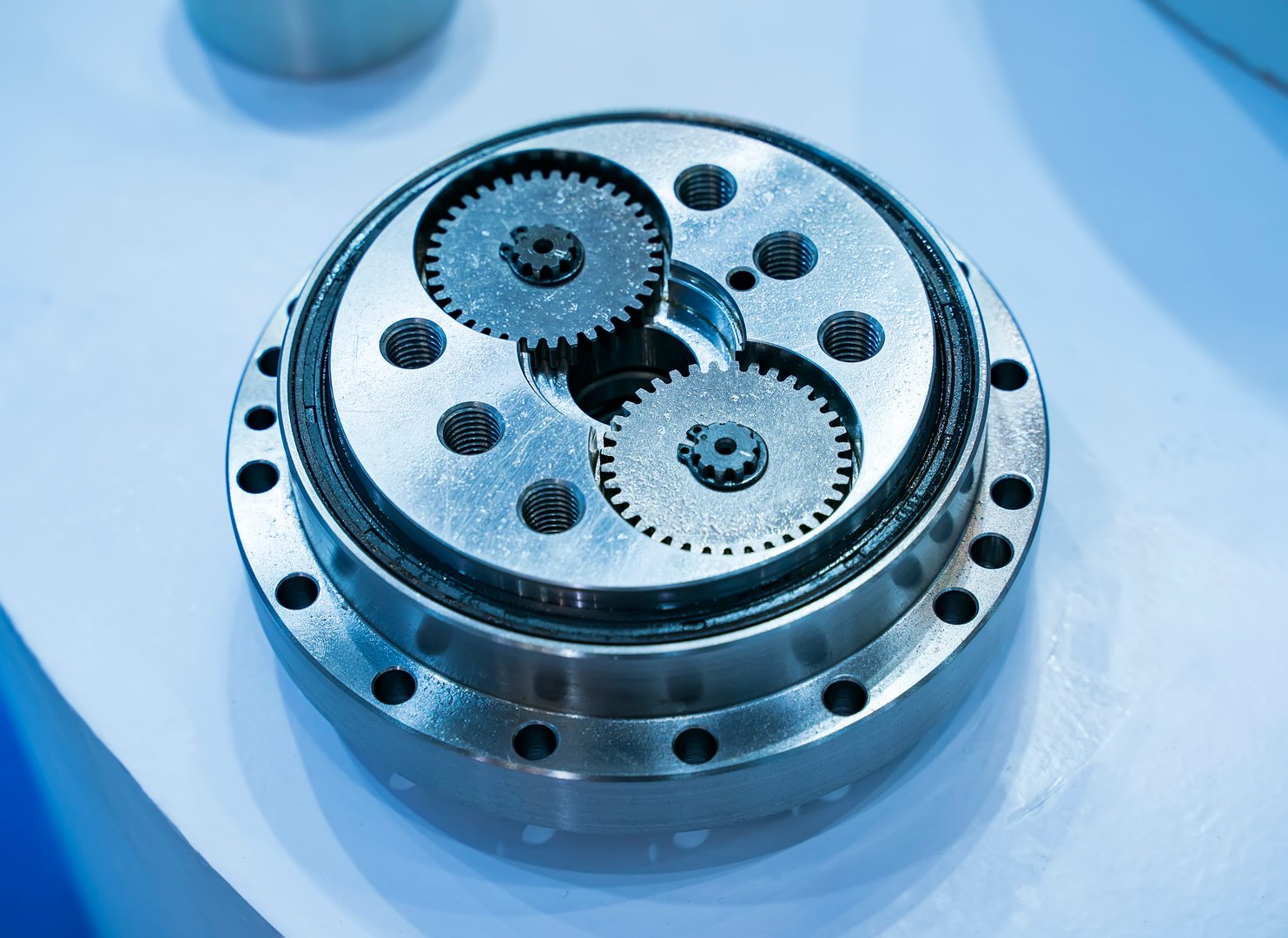 metal cog gears on blue background