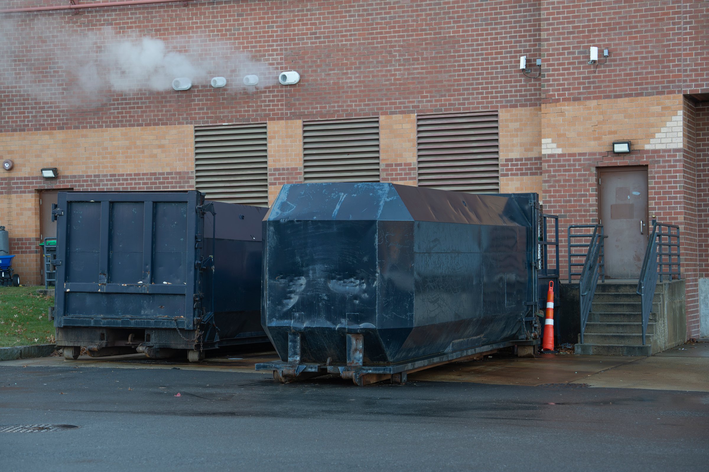 large commercial dumpster for trash and recycling
