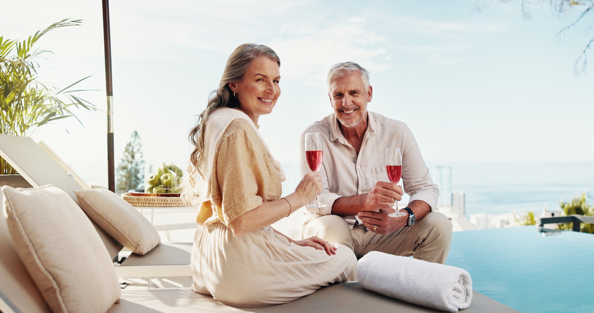Mature couple, portrait and wine on vacation, traveller and bonding on trip with alcohol and happy. Holiday, people and smile for anniversary on resort, travel or commitment in marriage