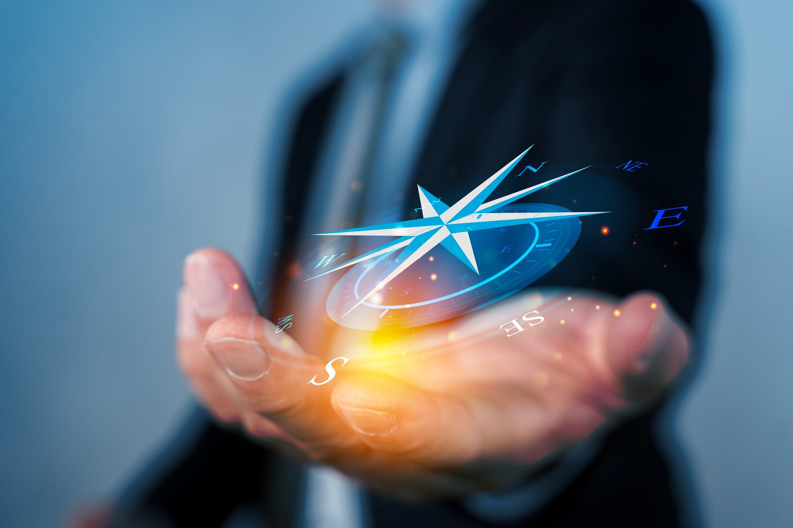 Concept of Strategic orientation in business or marketing. Purpose and direction in business. Compass in the hands of a businessman