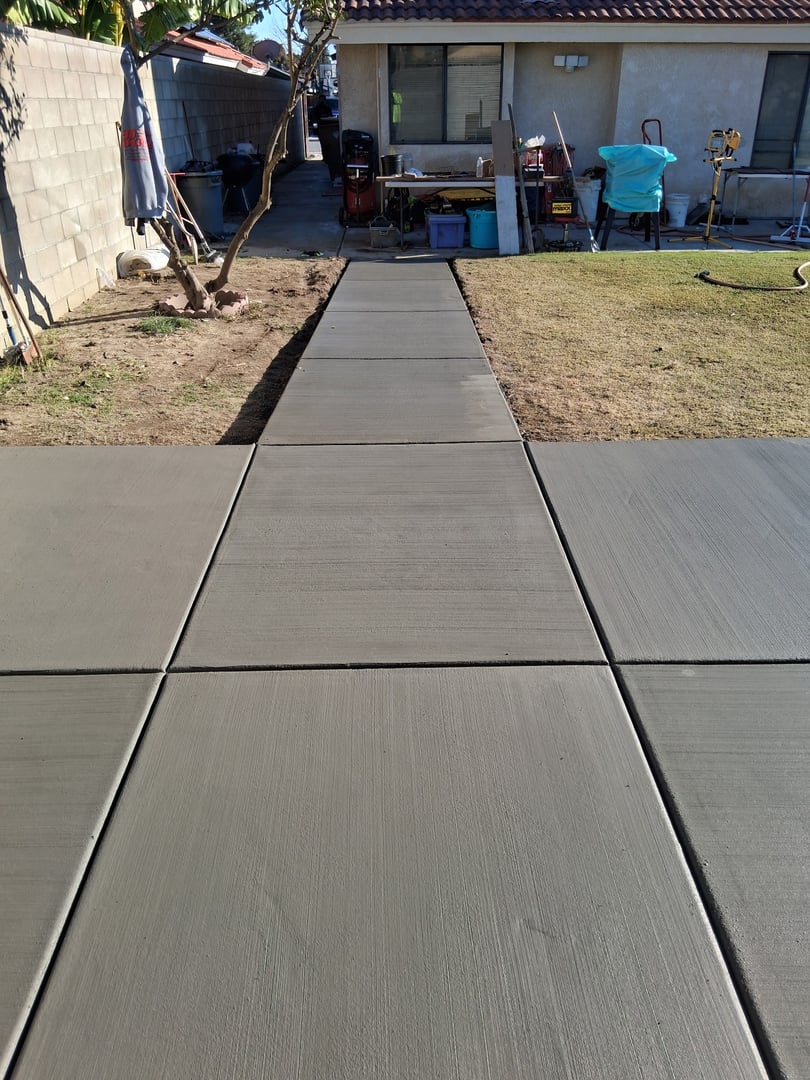 Residential storage shed concrete pad with walkway access in Bakersfield