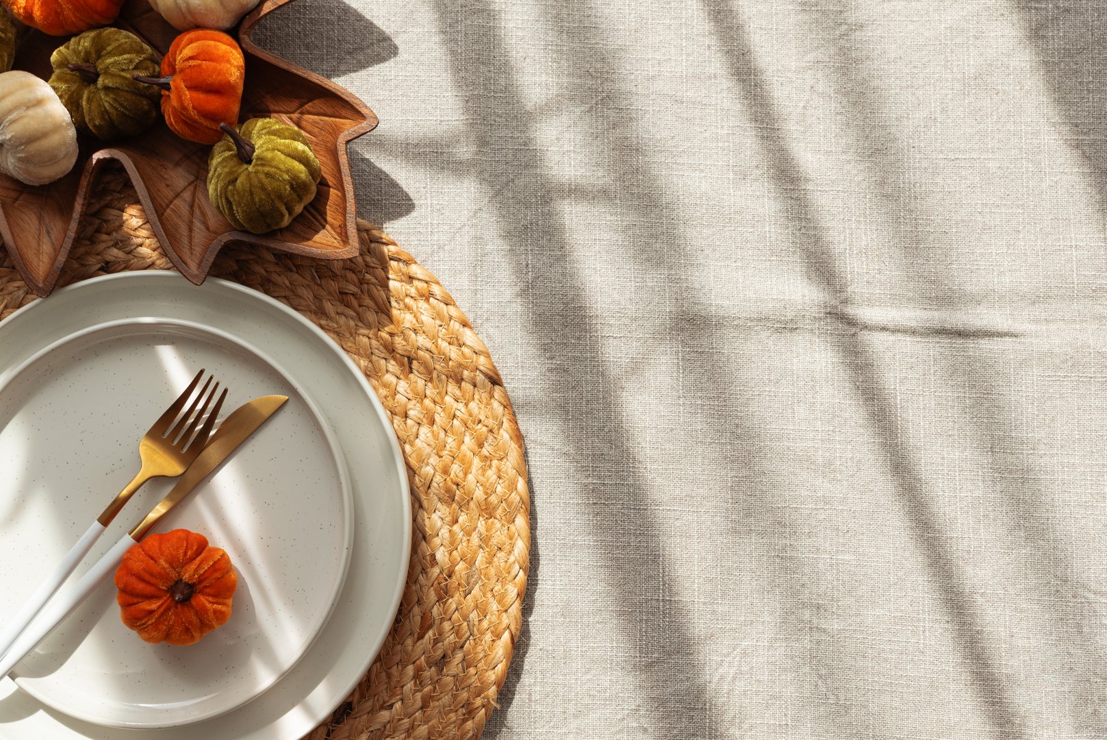 Autumn Table Setting with Pumpkins, Plates and Leaf-Shaped Bowl