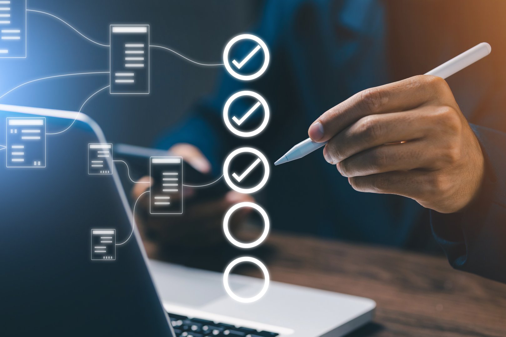 Hand holding a digital pen marking items on a virtual checklist connected to laptop, symbolizing project management, task organization, workflow process, and business productivity.