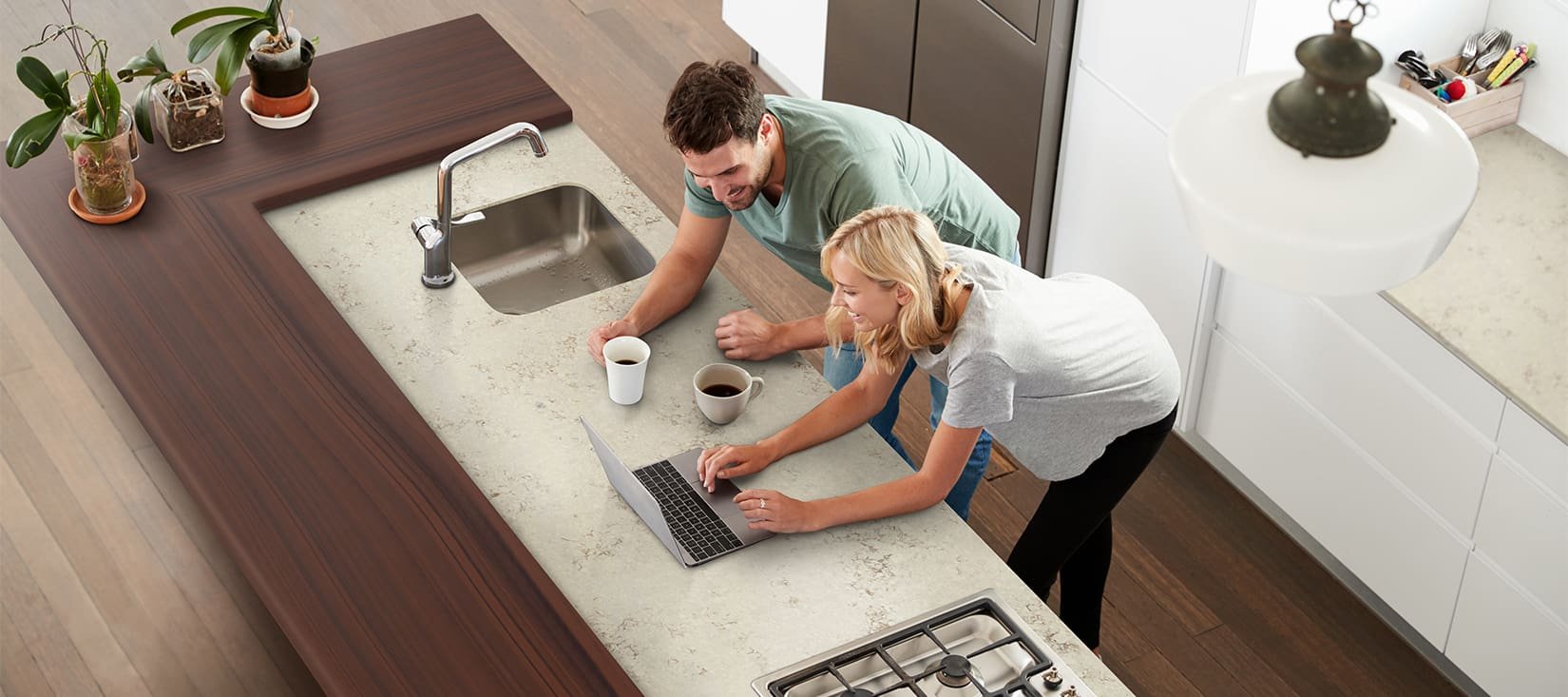 Happy Customer in Kitchen with their refreshed and restored countertops
