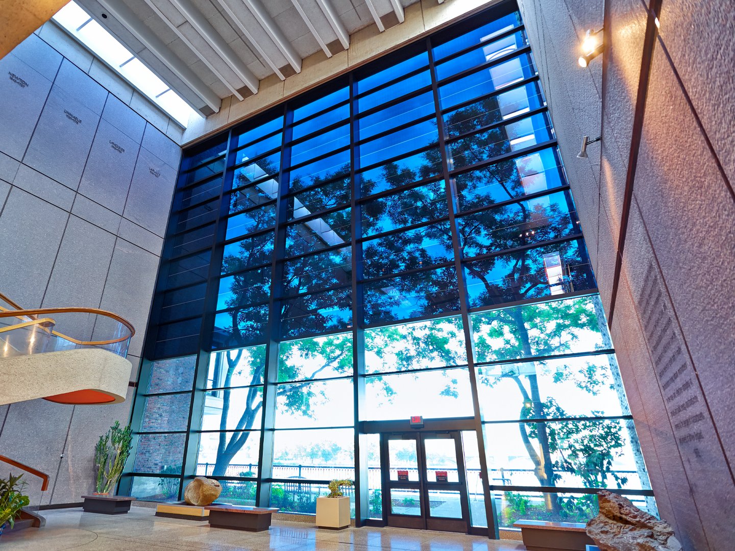 Modern residential window with privacy film showing blurred city view