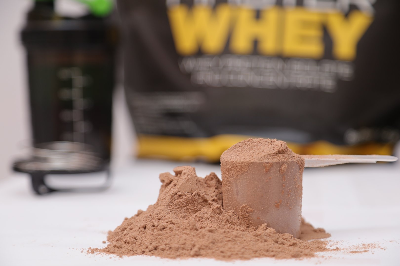 whey protein powder.  scoop of whey protein.  Sports nutrition for muscle growth