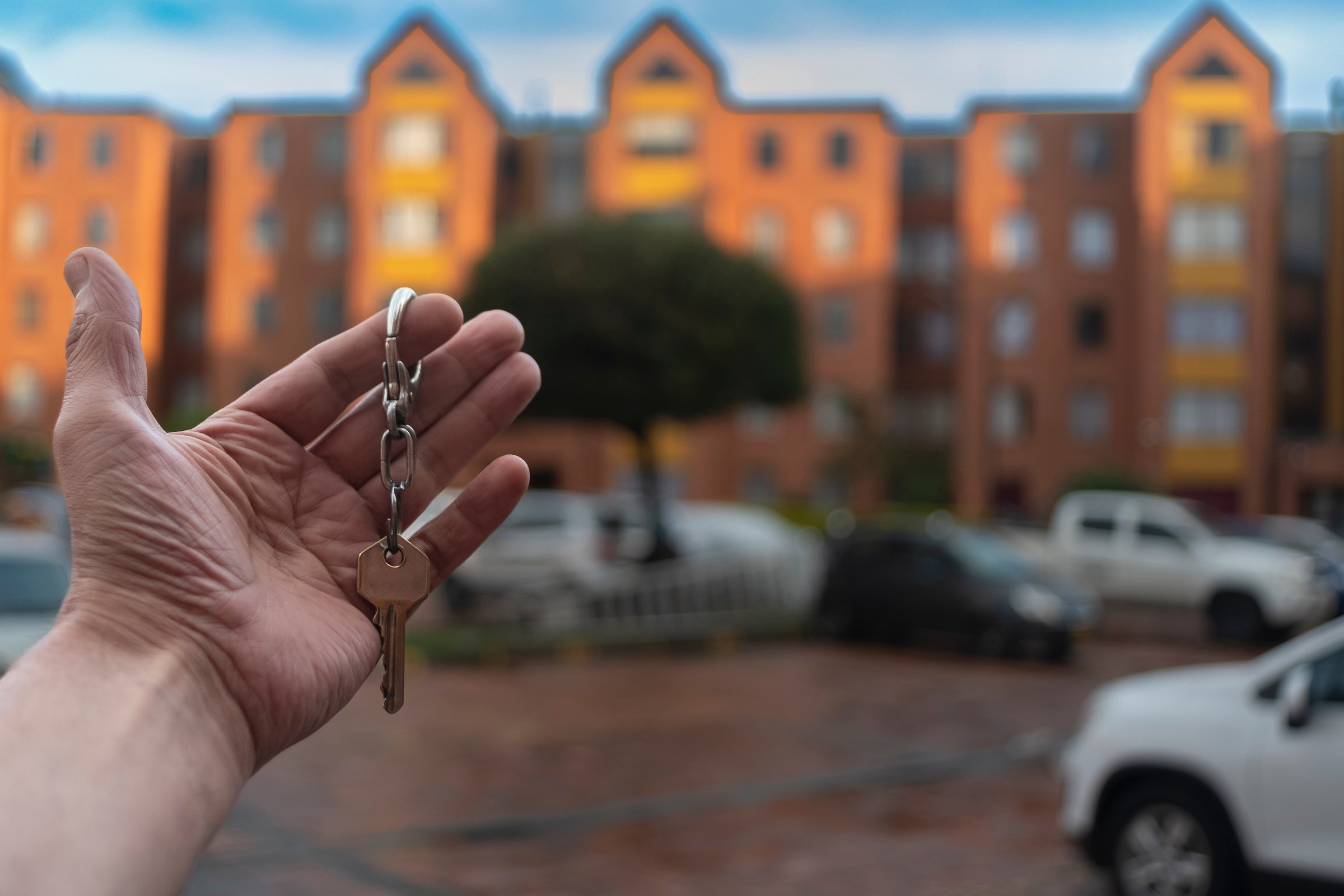 Real estate agent apartment condominium giving house keys to owner