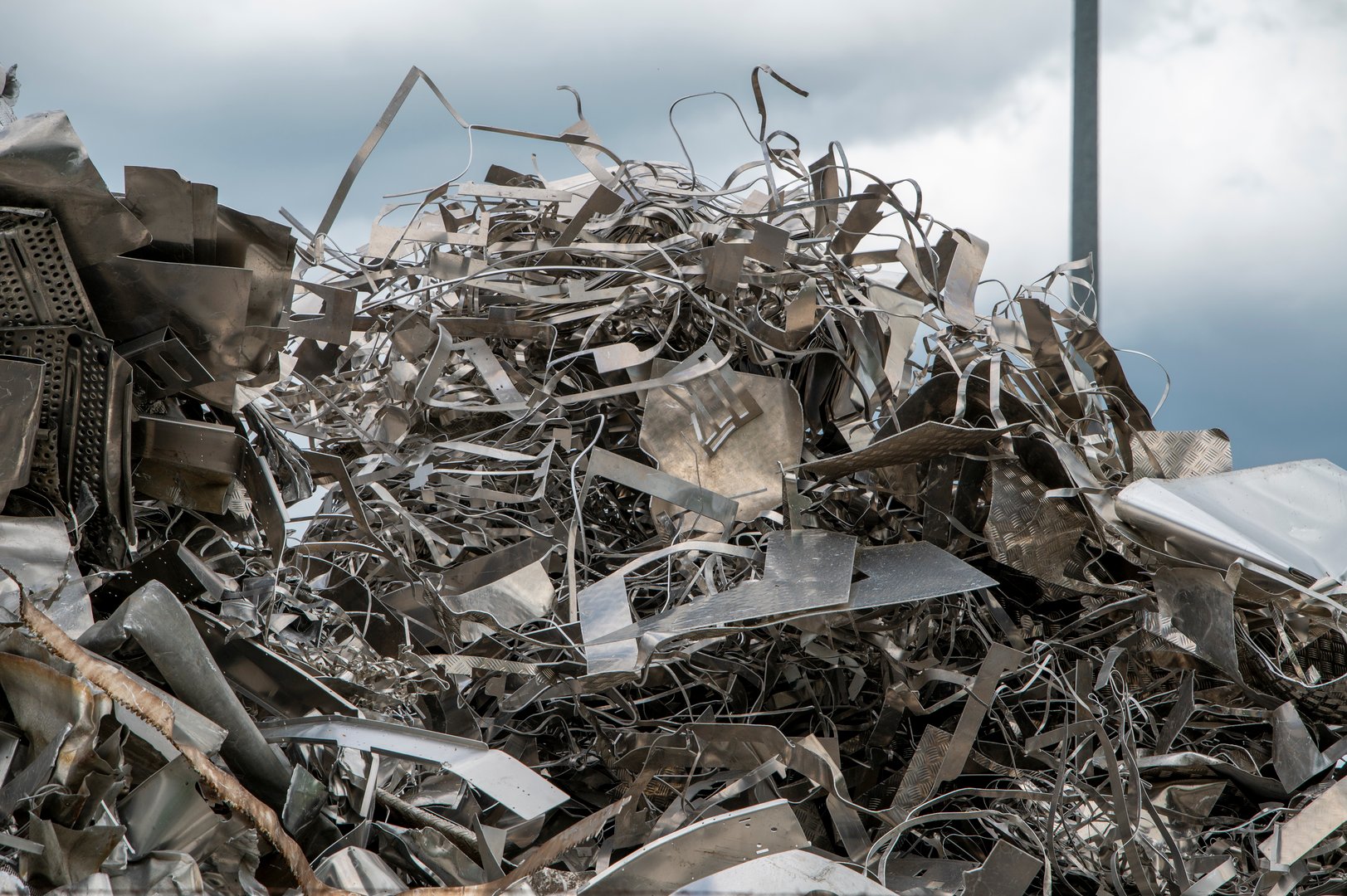 Scrap metal heap. Discarded material sorted and  prepared for recycling.