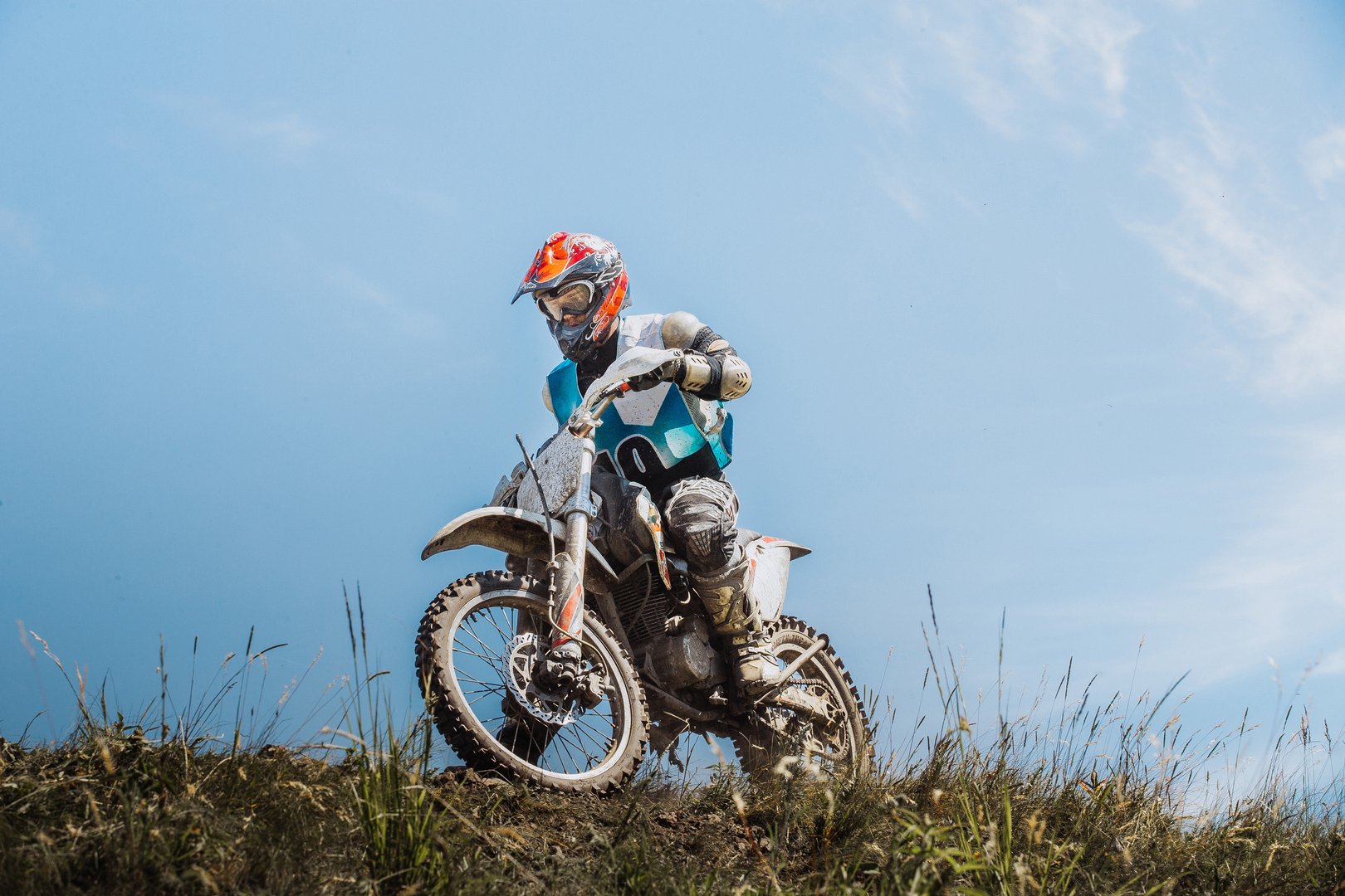 Kyshtym, Russia - June 19, 2016: male rider on a motorcycle on top of a mountain during Ural Cup in Enduro