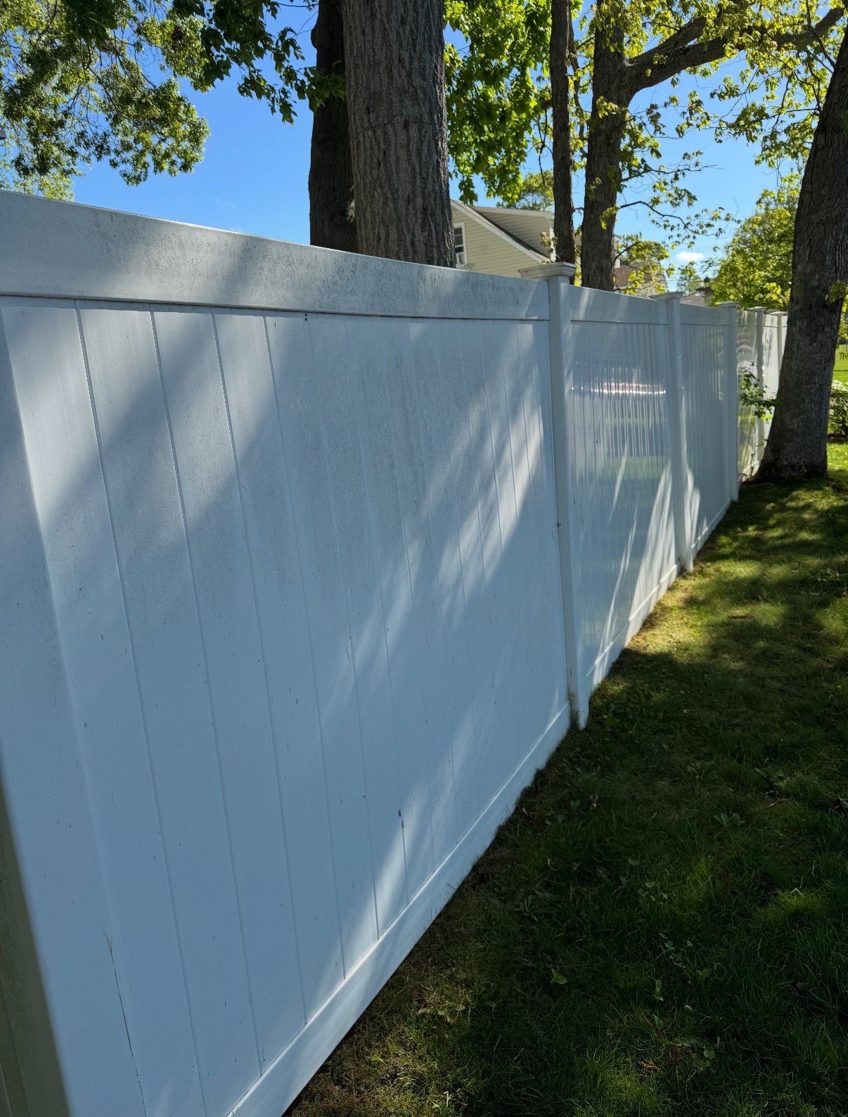 Clean fence after power washing