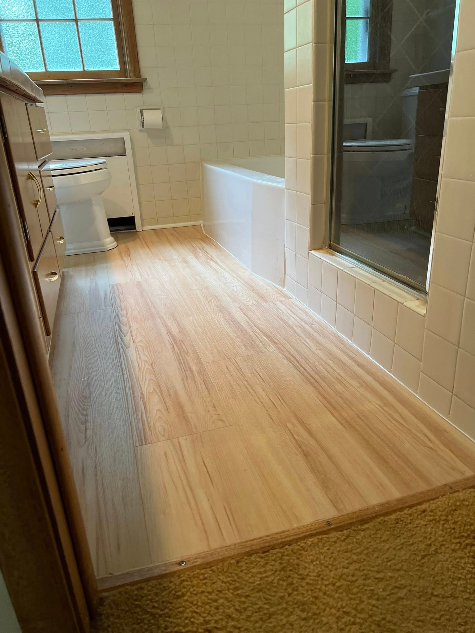 Completed bathroom remodel with modern tile shower in Toledo