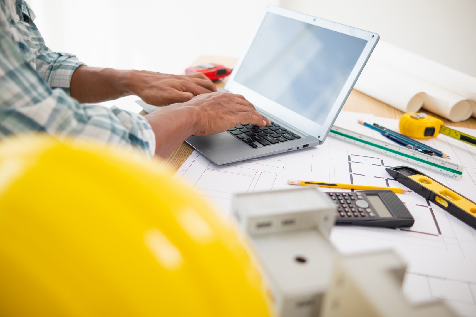 Construction engineers checking blueprints