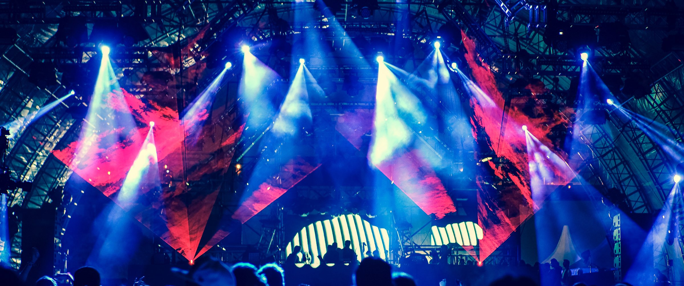 Defocused entertainment concert lighting on stage, blurred disco party and Concert Live.