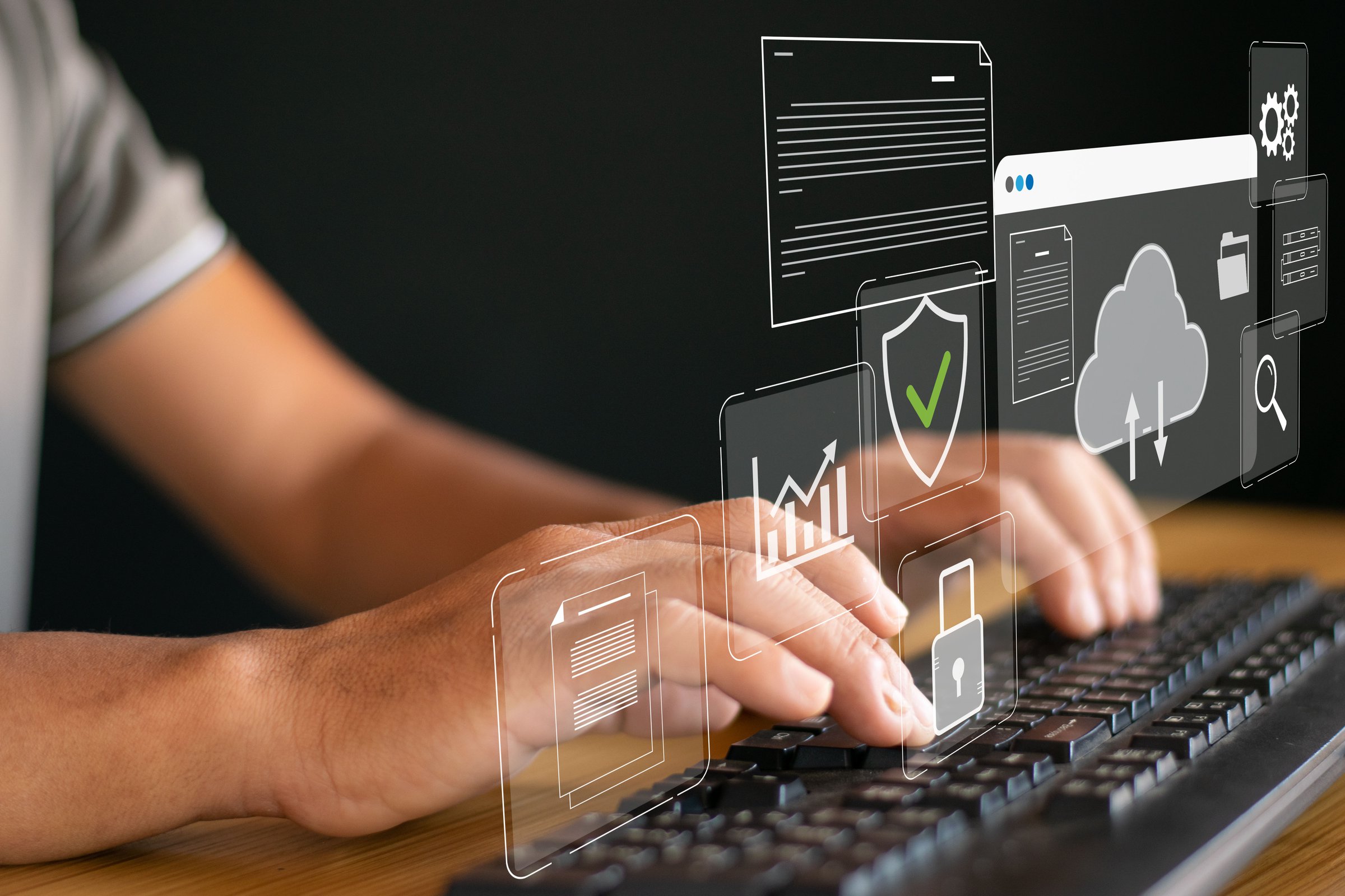 Business people use computers to store data on the cloud and transfer digital files, share documents, and back up data.