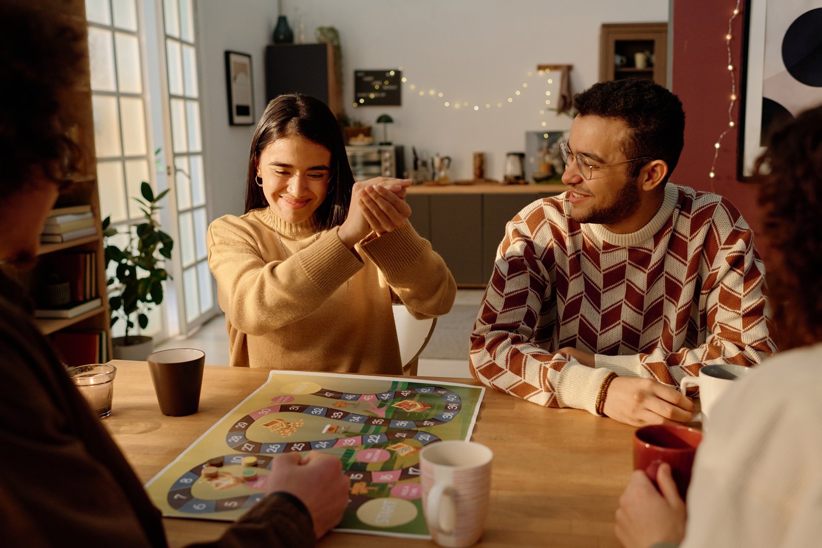 Group of friends playing board game