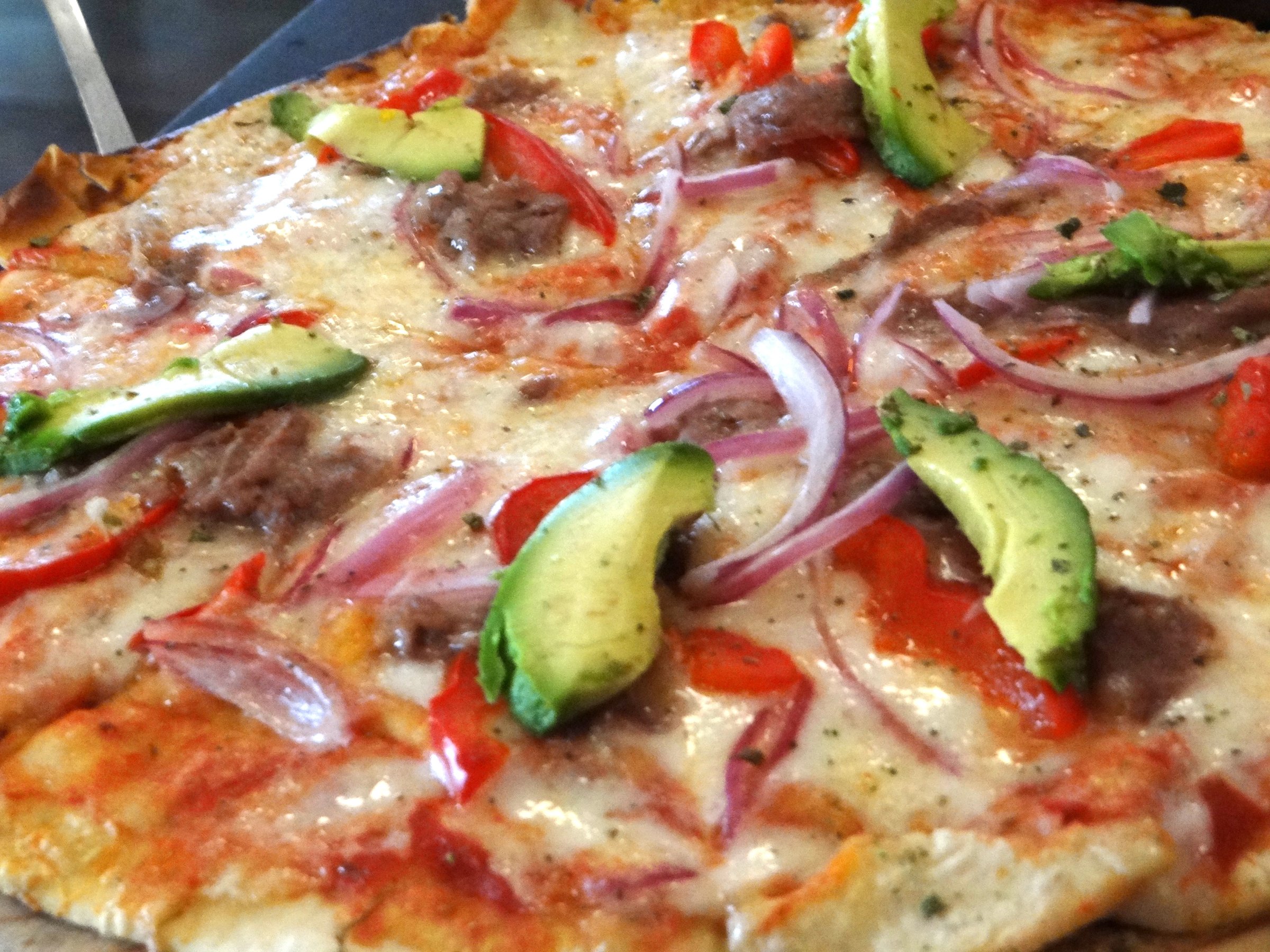 Mexican pizza with chicken, jalapeño, and avocado