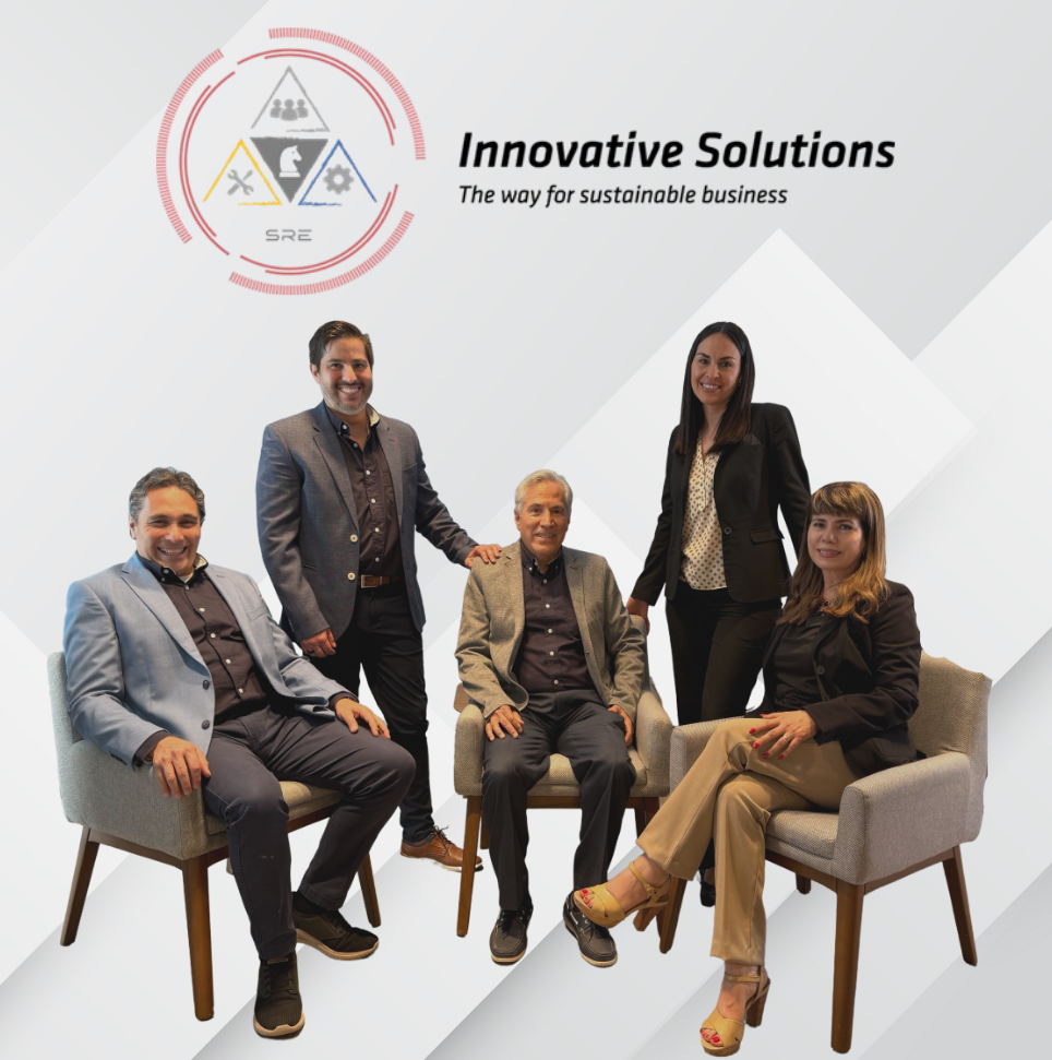 Professionals collaborate in a modern office environment with laptops and tablets, fostering teamwork and productivity. Participants engage in discussions and planning activities while showcasing a business-oriented atmosphere.