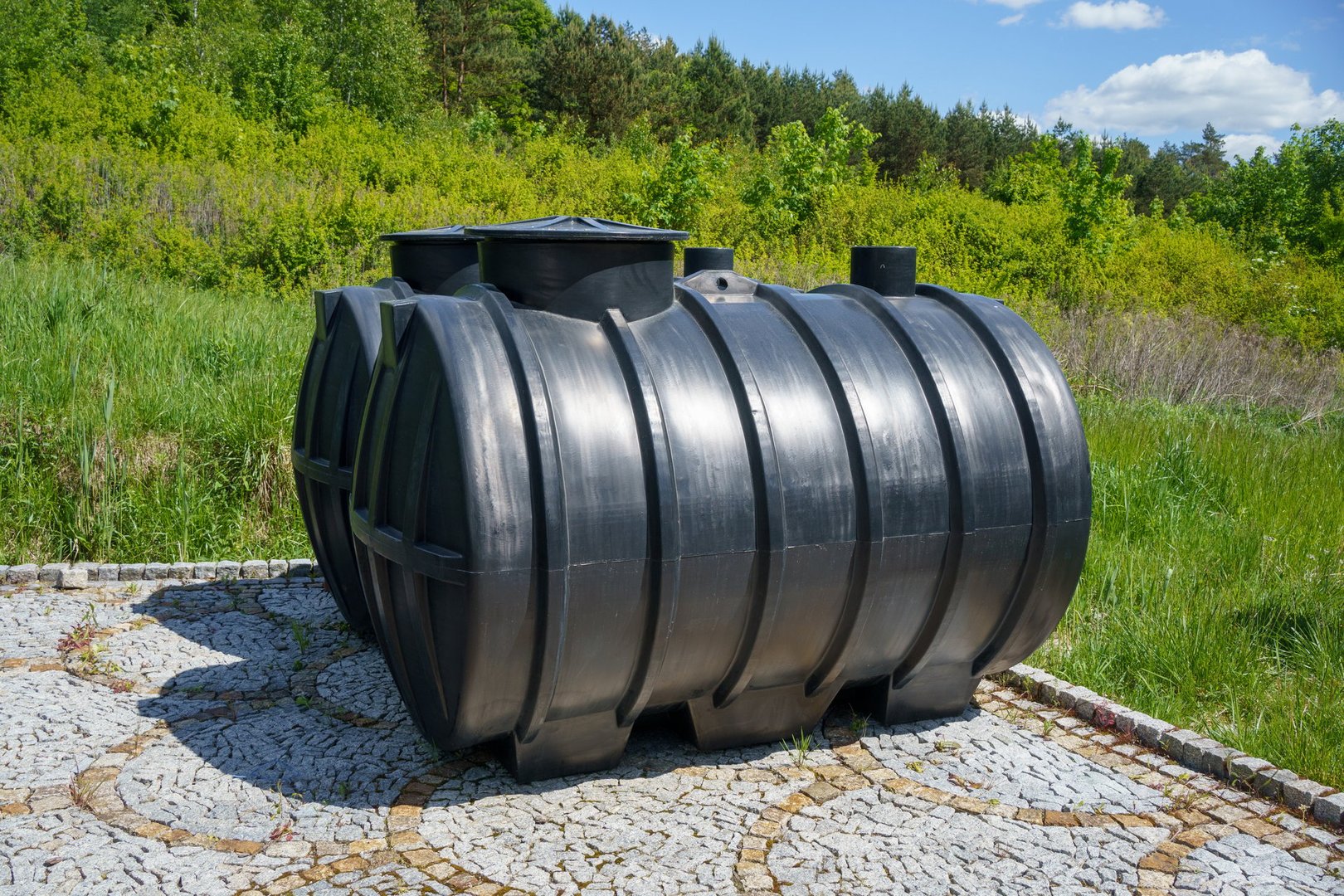 two copies of a plastic septic tank for a domestic sewage treatment plant, Poland