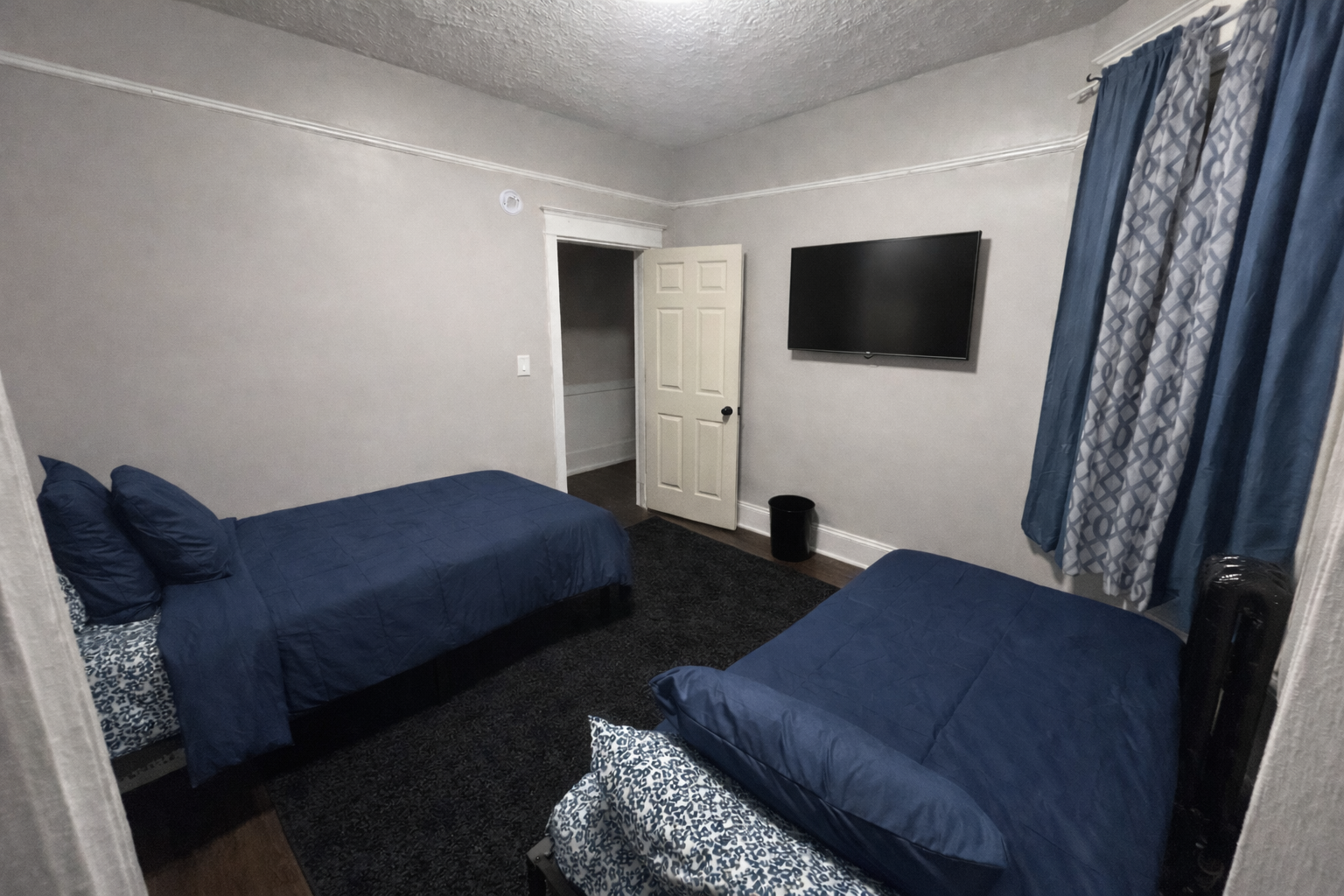 Shared bedroom with navy blue accents