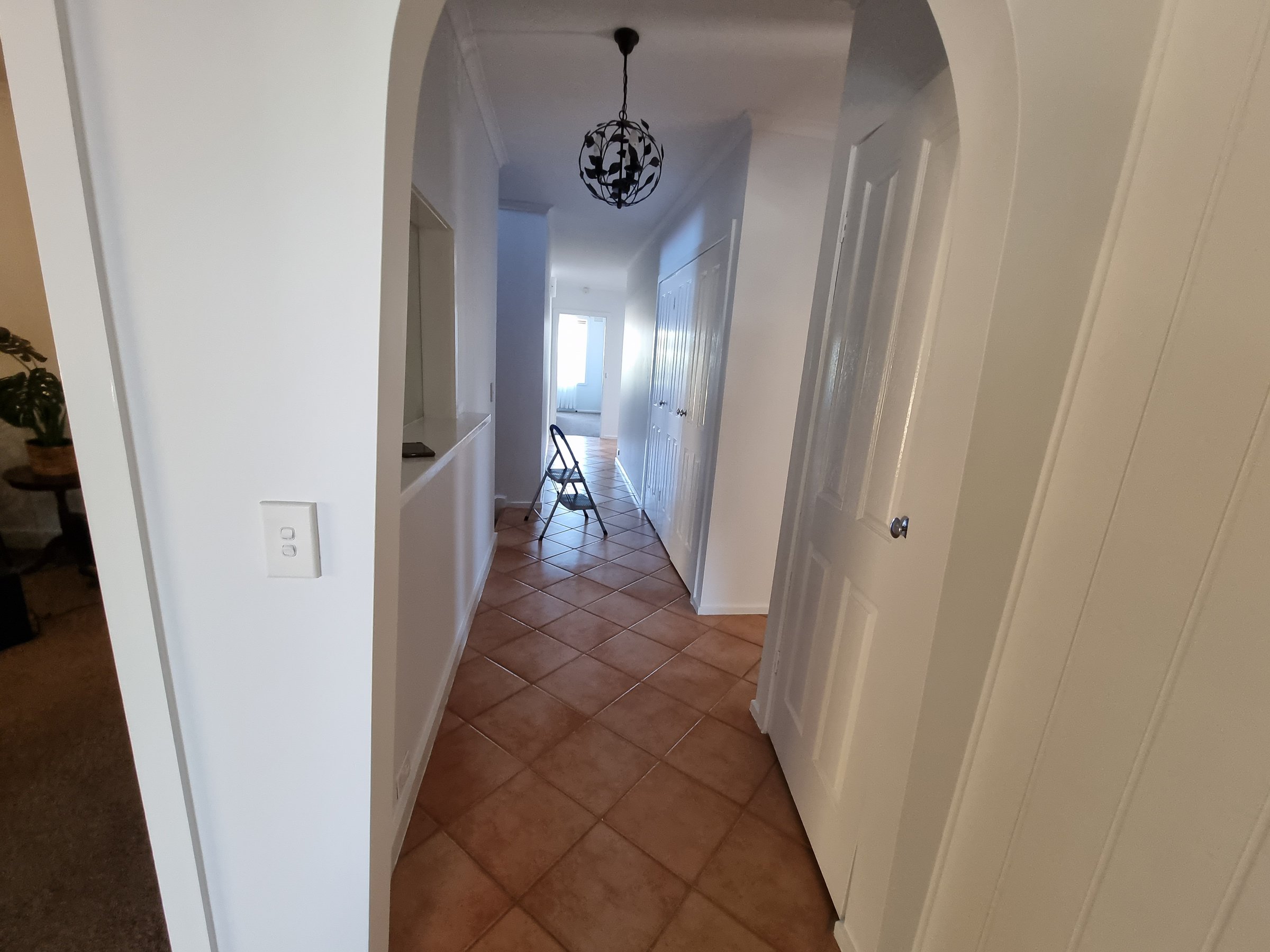 Quality Painting Group interior painting project completion - modern living room transformation