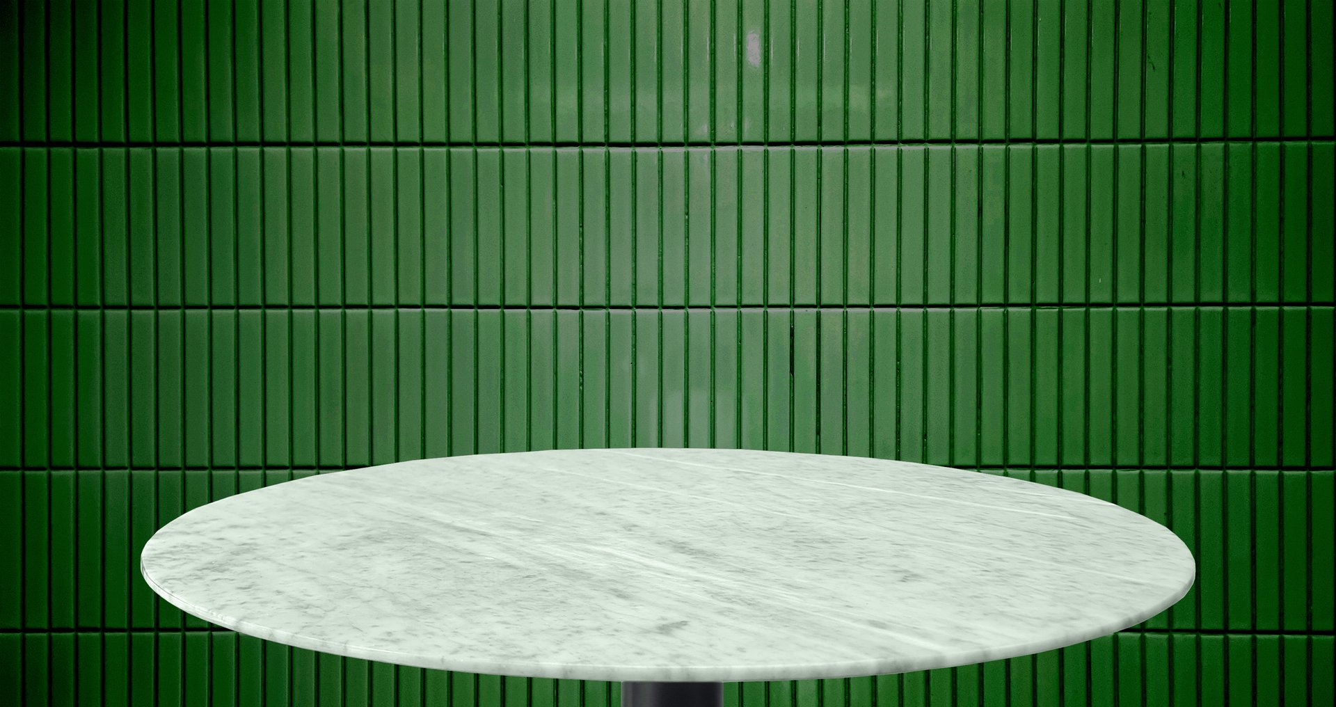 studio shot of a round, polished carrara marble stone tabletop with dark green tiles wall at background, suitable for use as a dining, display surface, advertising. round side table for design.