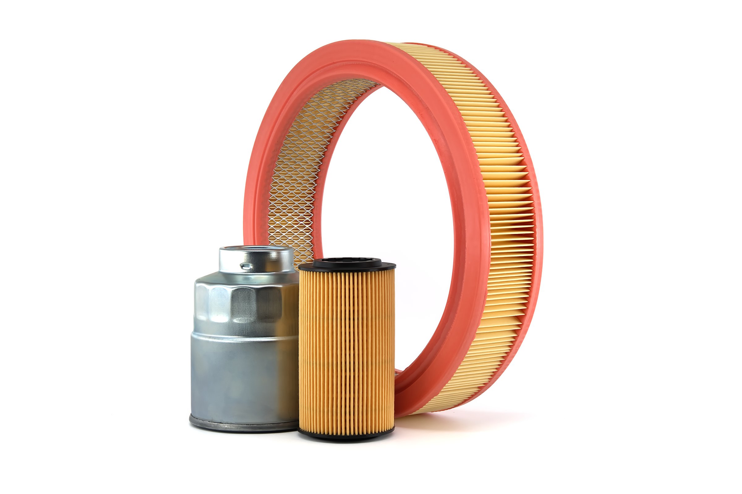 Car oil, fuel and air filters isolated on a white background. Car servicing, automotive industry and vehicle filters replacing maintenance