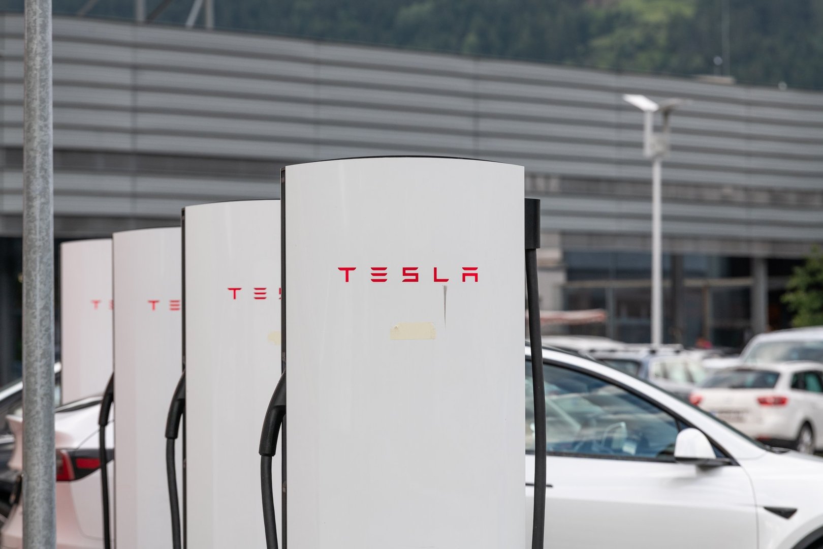 Charging station for electric cars on a parking lot. Tesla technology.  22 july 2024, Imst, Austria
