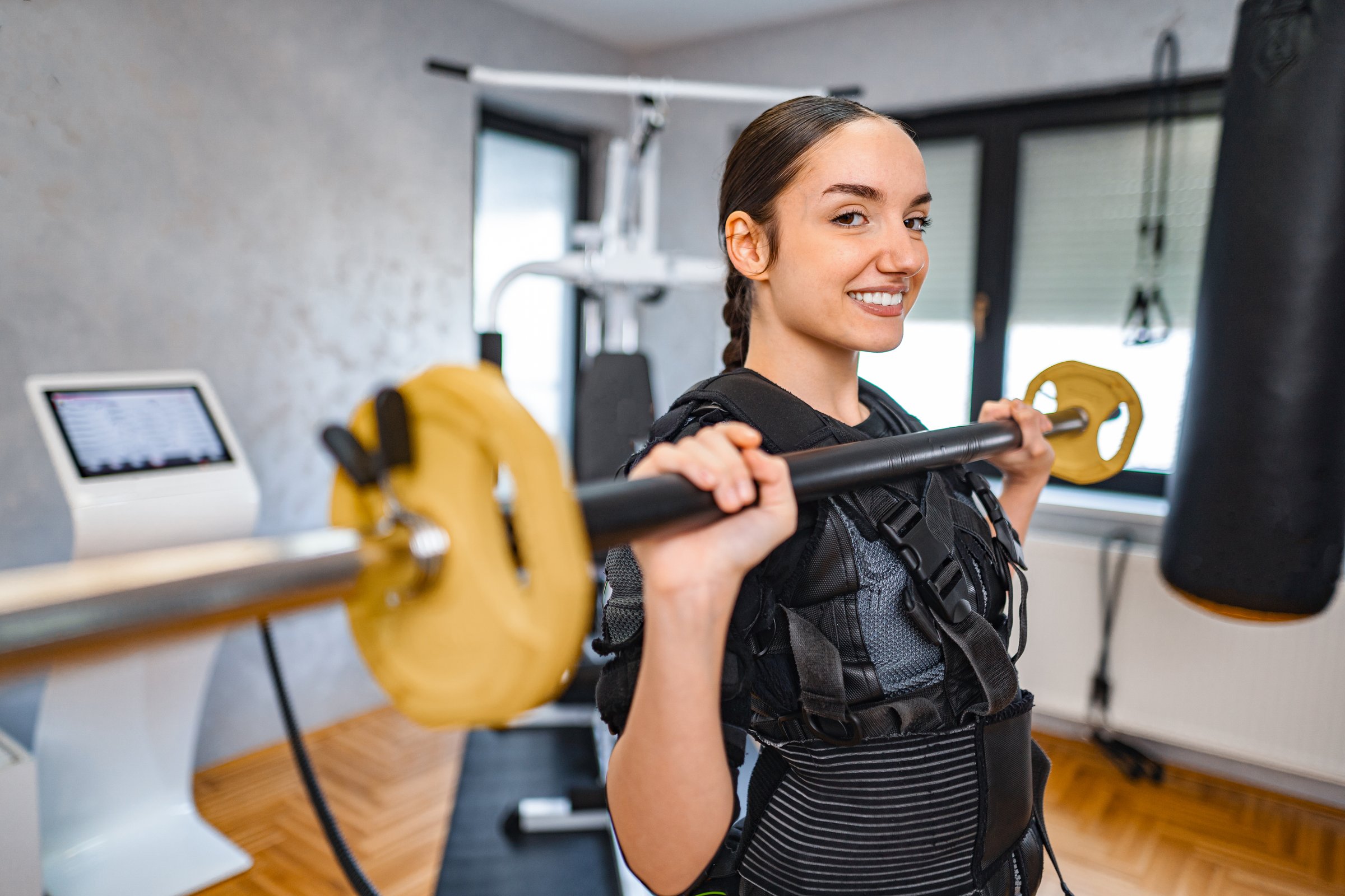 Modern EMS fitness studio with training equipment