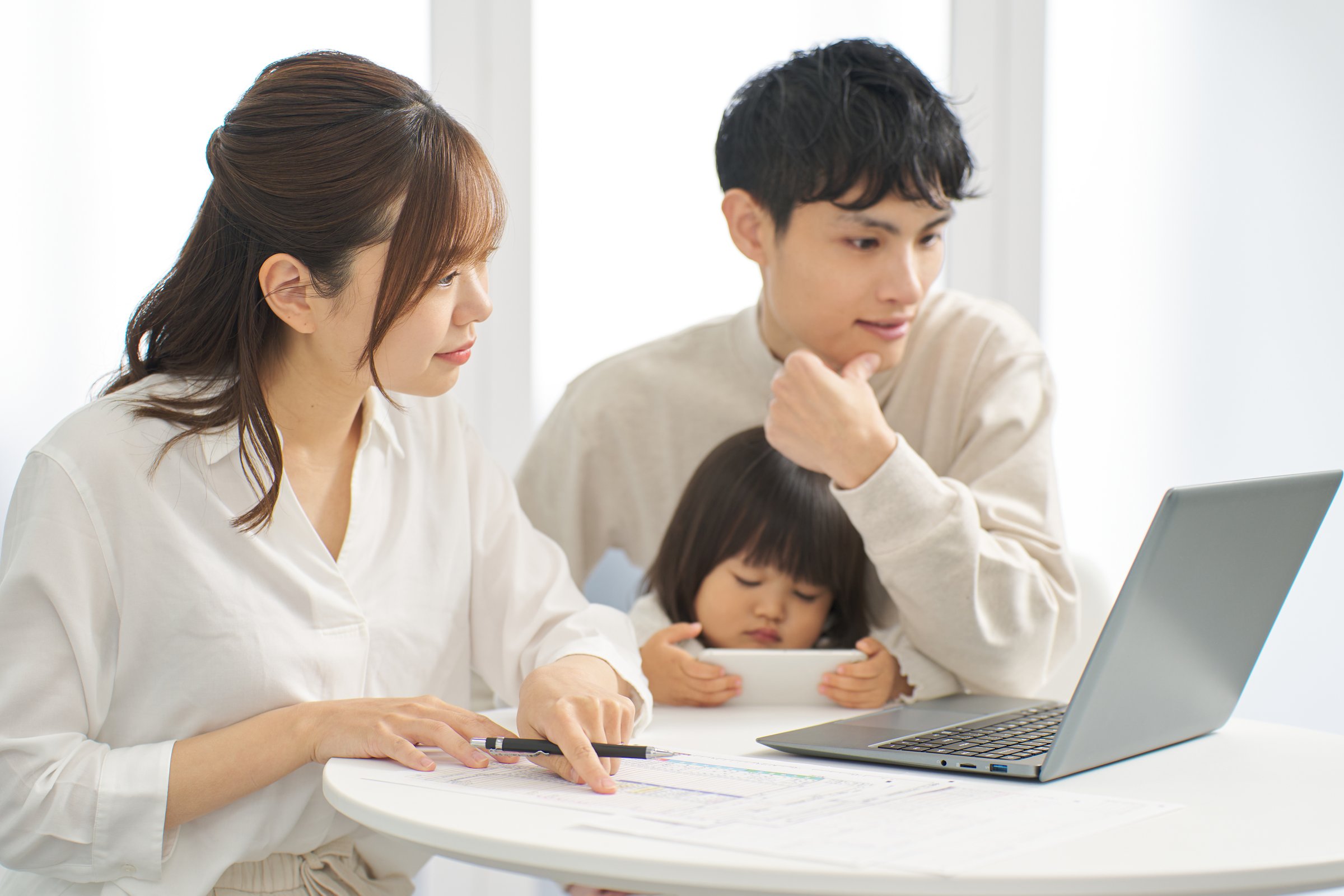 Asian family studying tax return online
