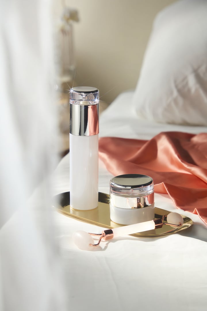 Luxurious skincare set on gold tray