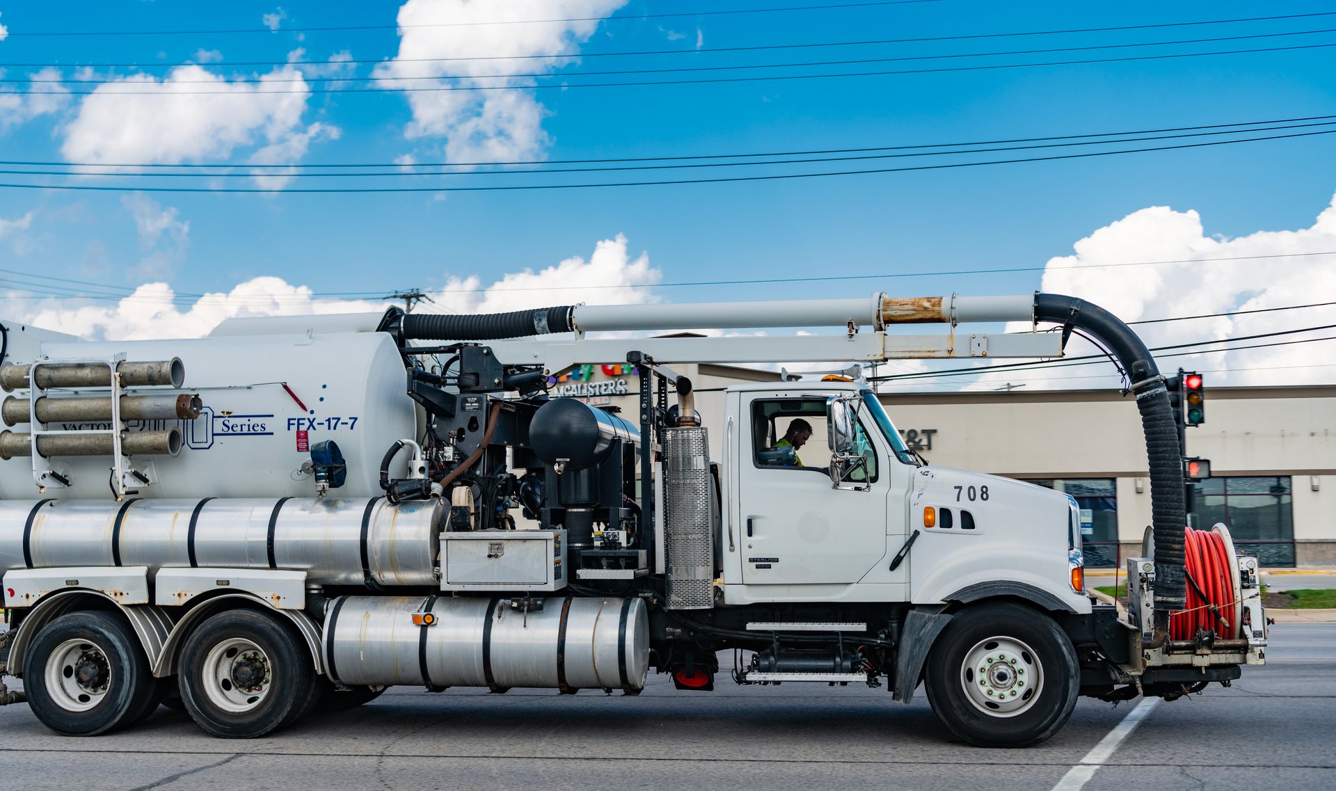 Park Ridge, Illinois, USA - August 17, 2024: 2006 Sterling L9500 Vactor 2112-J6 hydro excavation truck. Excavation truck of Sterling L9500. Truck of Sterling L9500 on road. Sterling truck, side view.