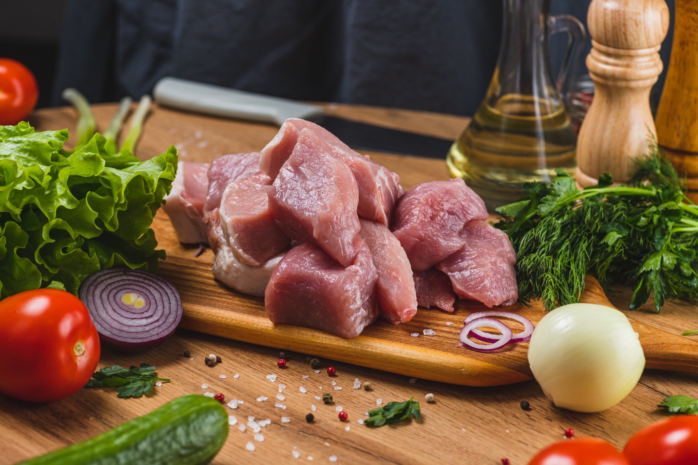 Sliced raw meat on a cutting board