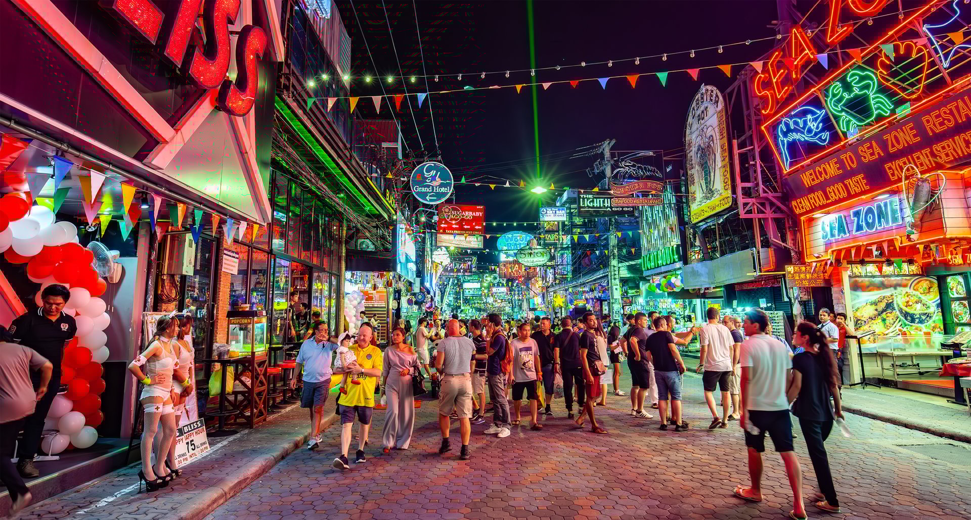 Pattaya, Thailand - 5 March, 2025: Pattaya Walking Street, main nightlife street with go-go bars and strip clubs. People walking down the street.