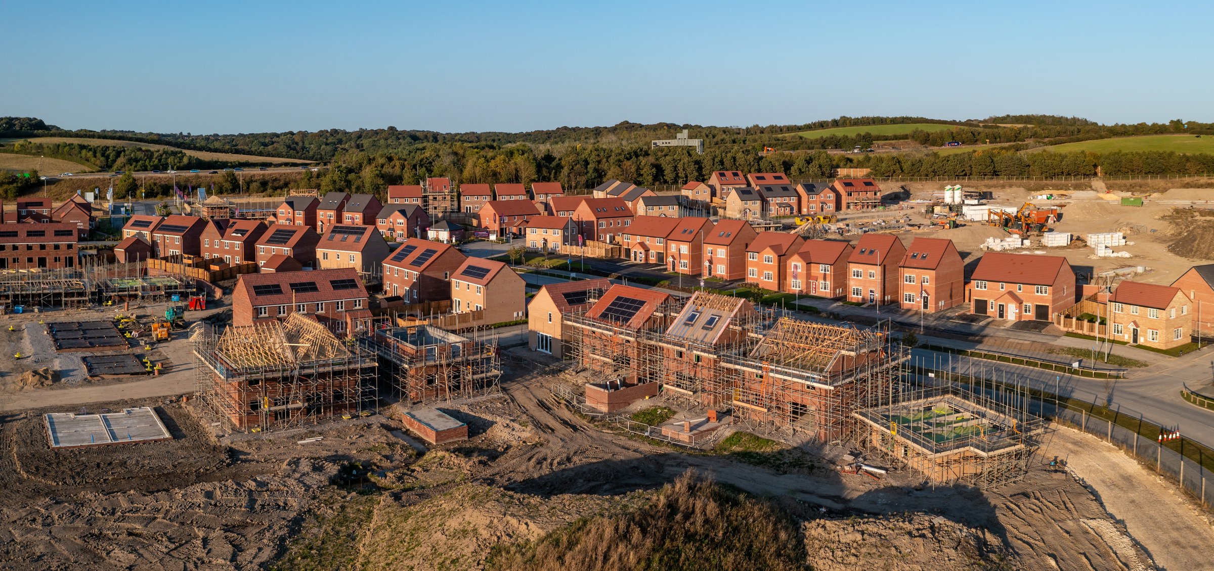 Aerial panoramic landscape view of a new build housing estate with houses under construction to fill the gap in the UK home shortage and supplement the UK Government's Right To Buy policy