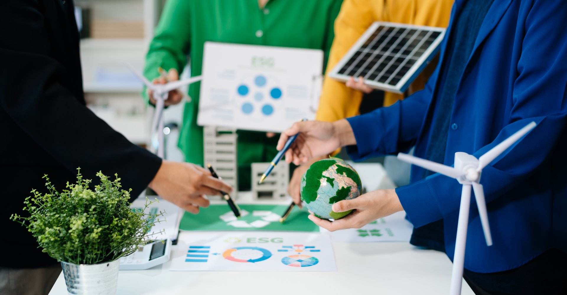 Business team working virtual modern smartphone to reduce CO2 emissions carbon footprint climate change to limit global warming.Sustainable development and green business concept. at office