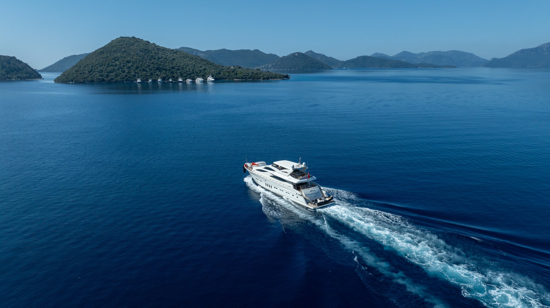Fethiye, Muğla, TURKEY – September 9, 2025: A premium white yacht cruising smoothly across deep blue waters, highlighting elegance and modern marine craftsmanship.