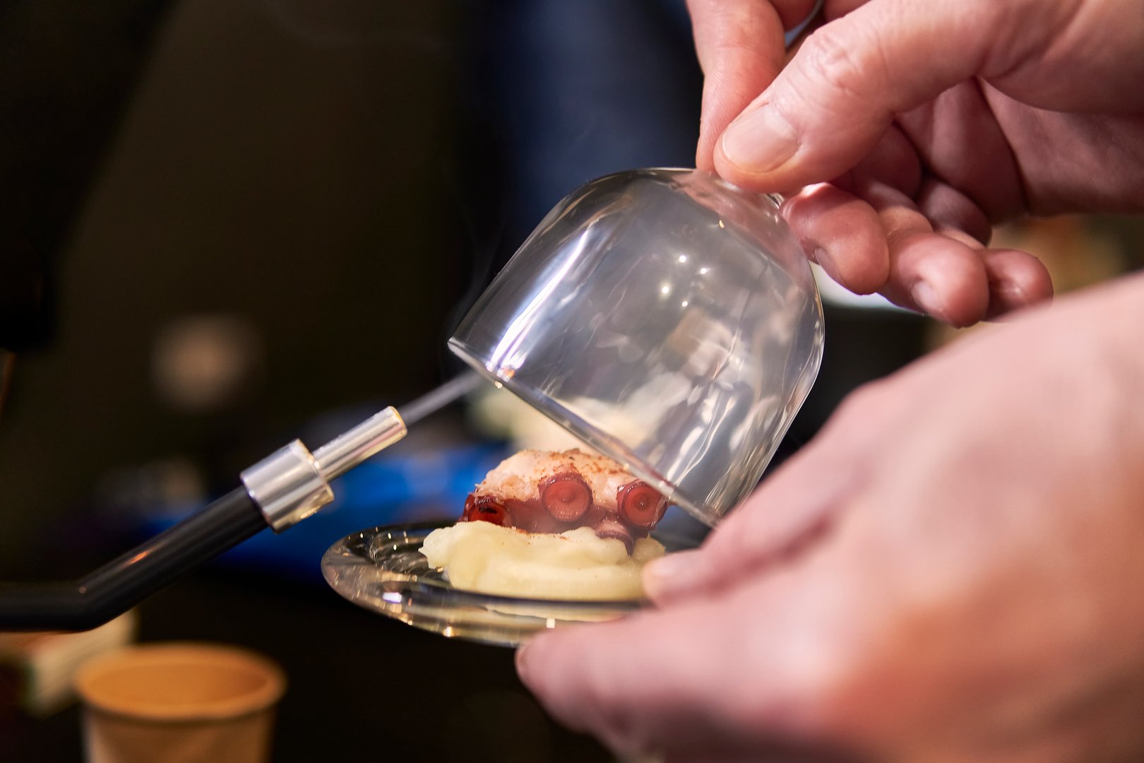 Gourmet Smoked Octopus Tapas: A Spanish chef creating a Sophisticated mini dish with innovative techniques