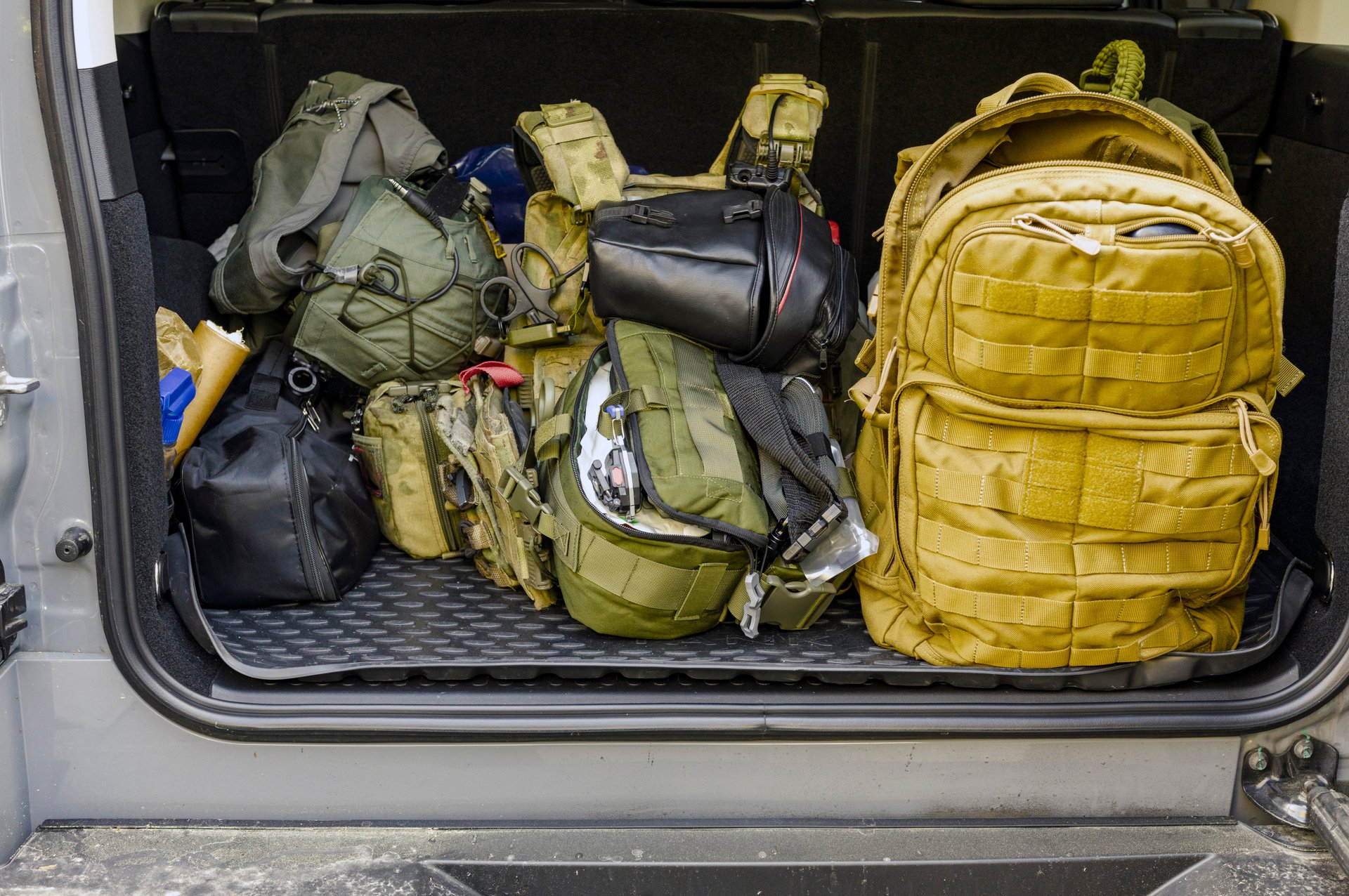 first aid kits and military looking stuff in a car boot