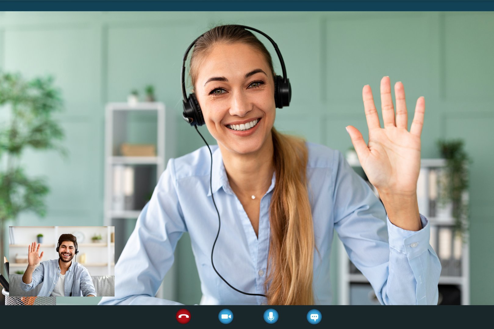 Happy female teacher wearing headphones while having video conference, waving and smiling to webcamera, screenshot. Videocall interface, app display, videotelephony and telecommuting