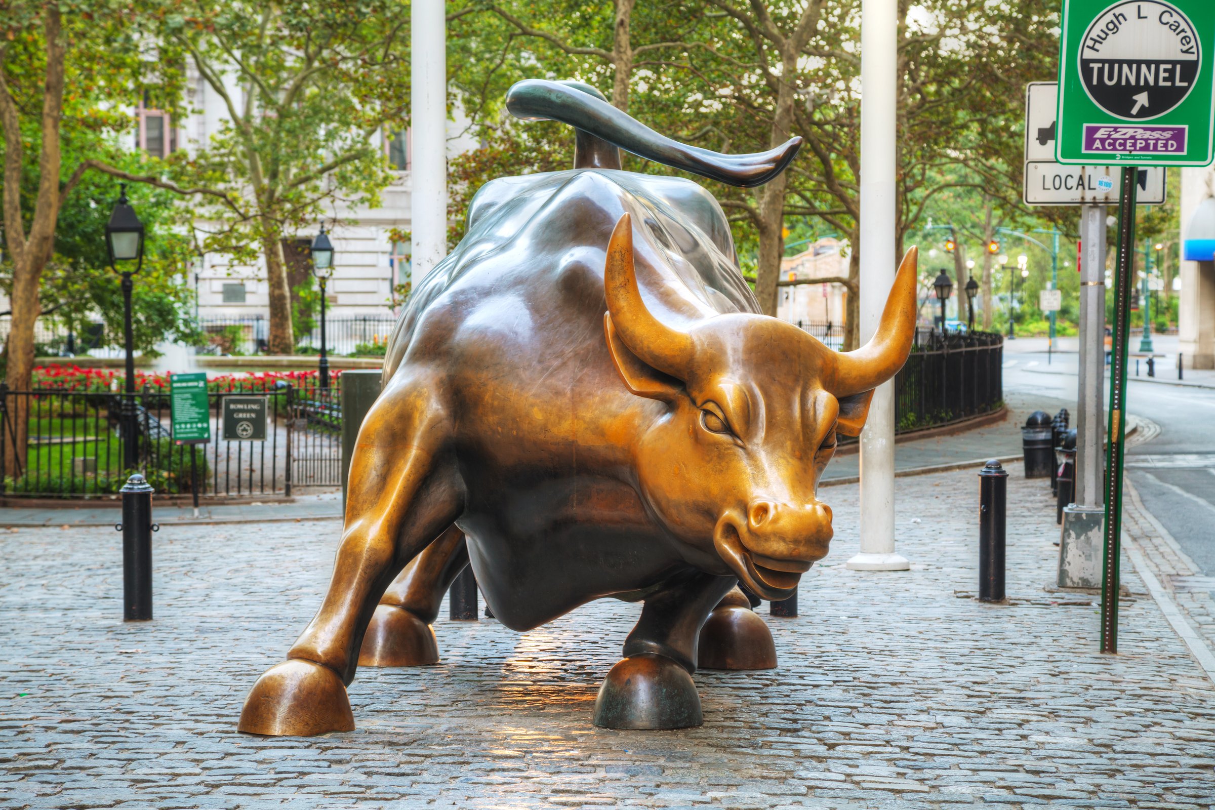 New York, USA - September 5, 2015: Charging Bull sculpture. The sculpture is both a popular tourist destination, as well as "one of the most iconic images of New York".