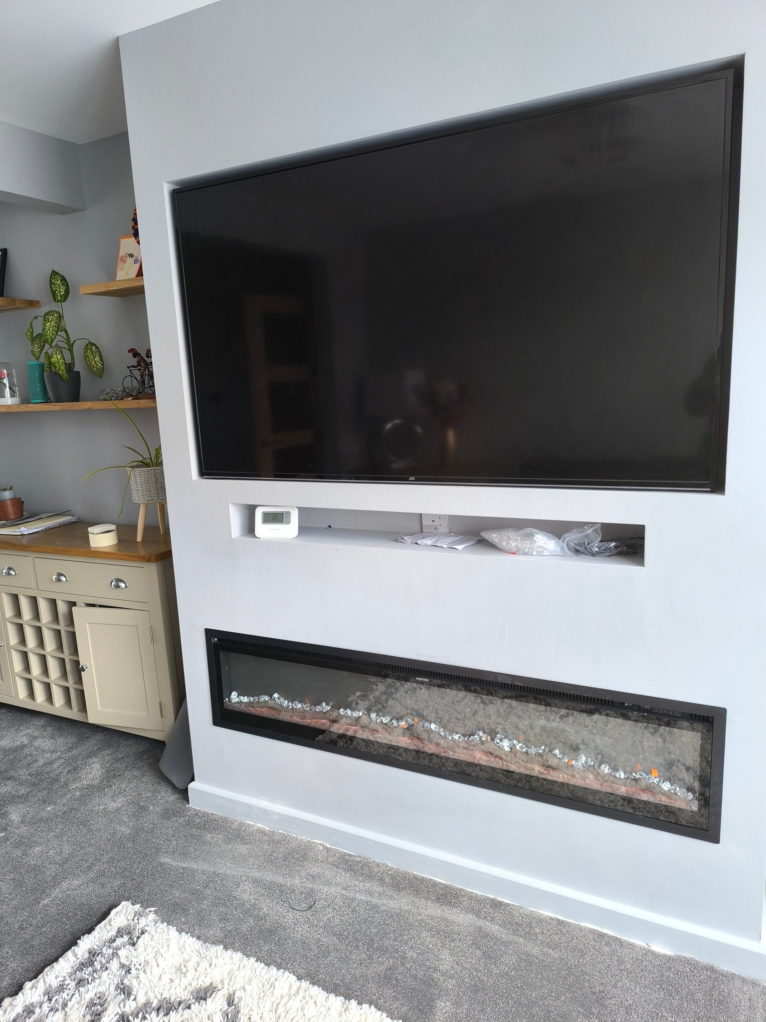 Newly built home bathroom interior primary or master bath with glass wall shower white marble granite floors and countertops large windows with blinds covering free standing bathtub sinks black fixtures bright spacious modern