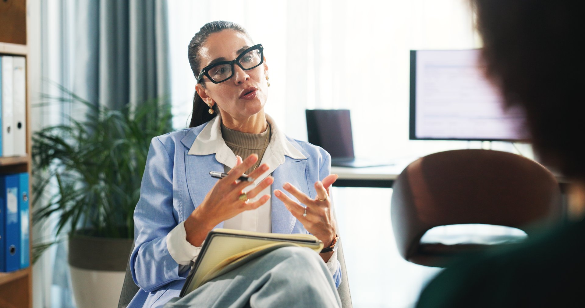 Woman, therapist and talk to patient for counseling session, medical advice and assessment notes. Psychologist, explain and consultation with person, evaluation and information for recovery treatment