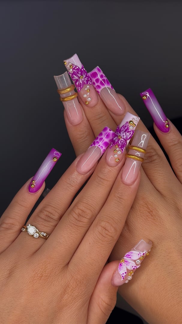 Woman's hands with purple acrylic nails