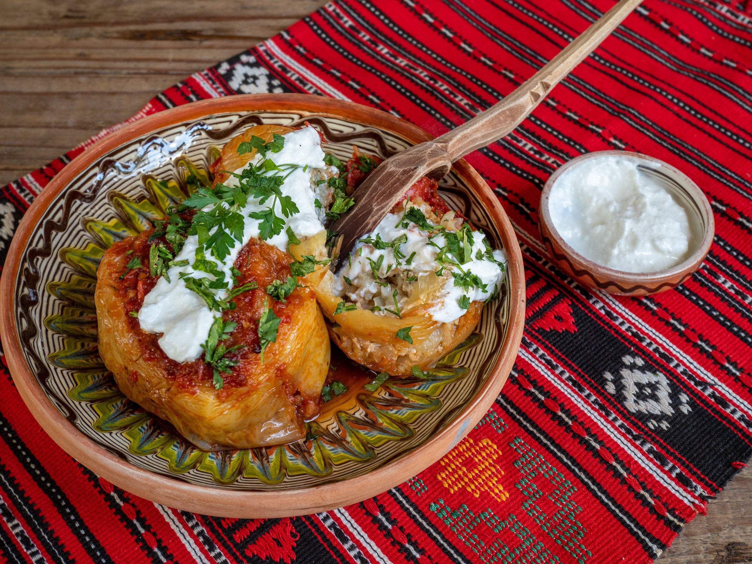 bell peppers stuffed with minced meat and served with sour cream, balkan  romanian cuisine
