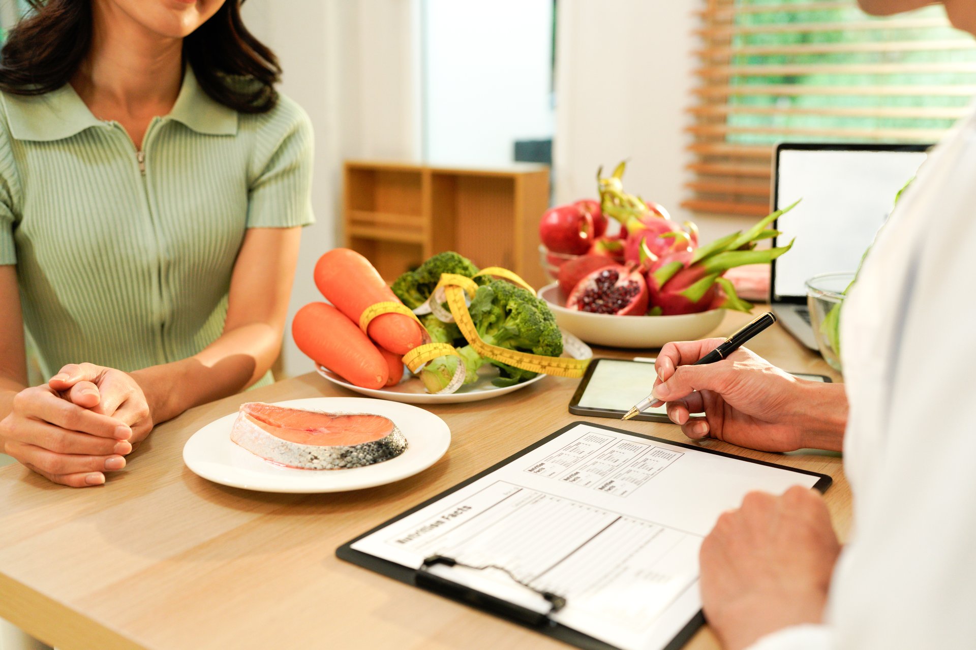 The healthcare professional providing nutritional guidance to a patient..