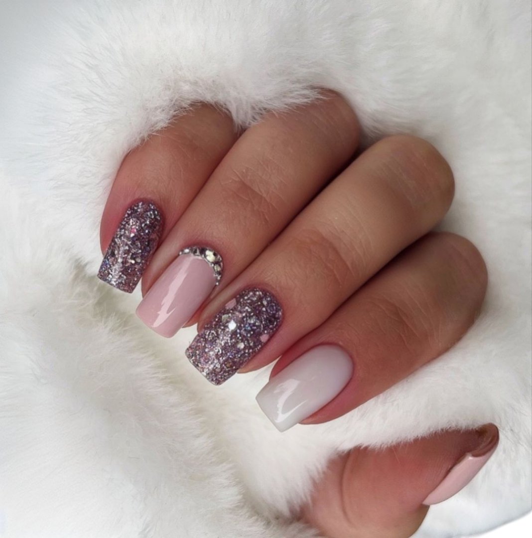 High quality detailed close-up of professional manicure showing beautifully styled nails with glossy polish and artistic nail art patterns, highlighting graceful feminine hands with smooth radiant skin, elegant nail shapes, and refined decoration that represents modern beauty standards, luxury spa treatments, fashion lifestyle, and professional cosmetic care, captured with perfect clarity and lighting to emphasize glamour, sophistication, and creativity, suitable for beauty salon promotions, luxury cosmetic advertising campaigns, fashion magazine editorials, wellness branding, online shop product listings, social media content, and digital marketing projects focused on elegance, style, and professional nail artistry