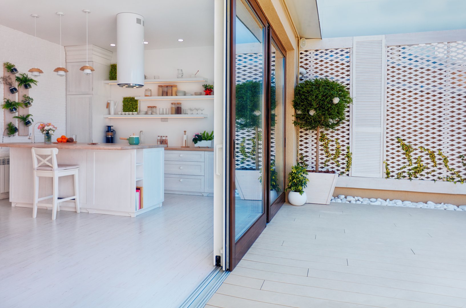 open space kitchen with sliding doors and rooftop patio zone