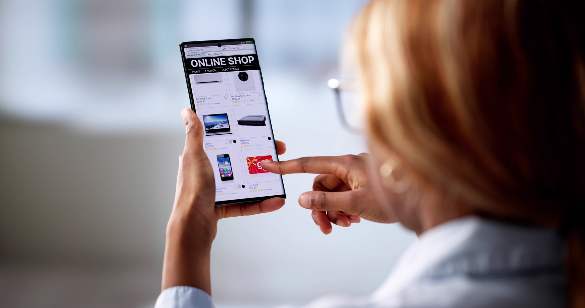 Online Fashion Shopping: Young African American Woman Uses Mobile Device