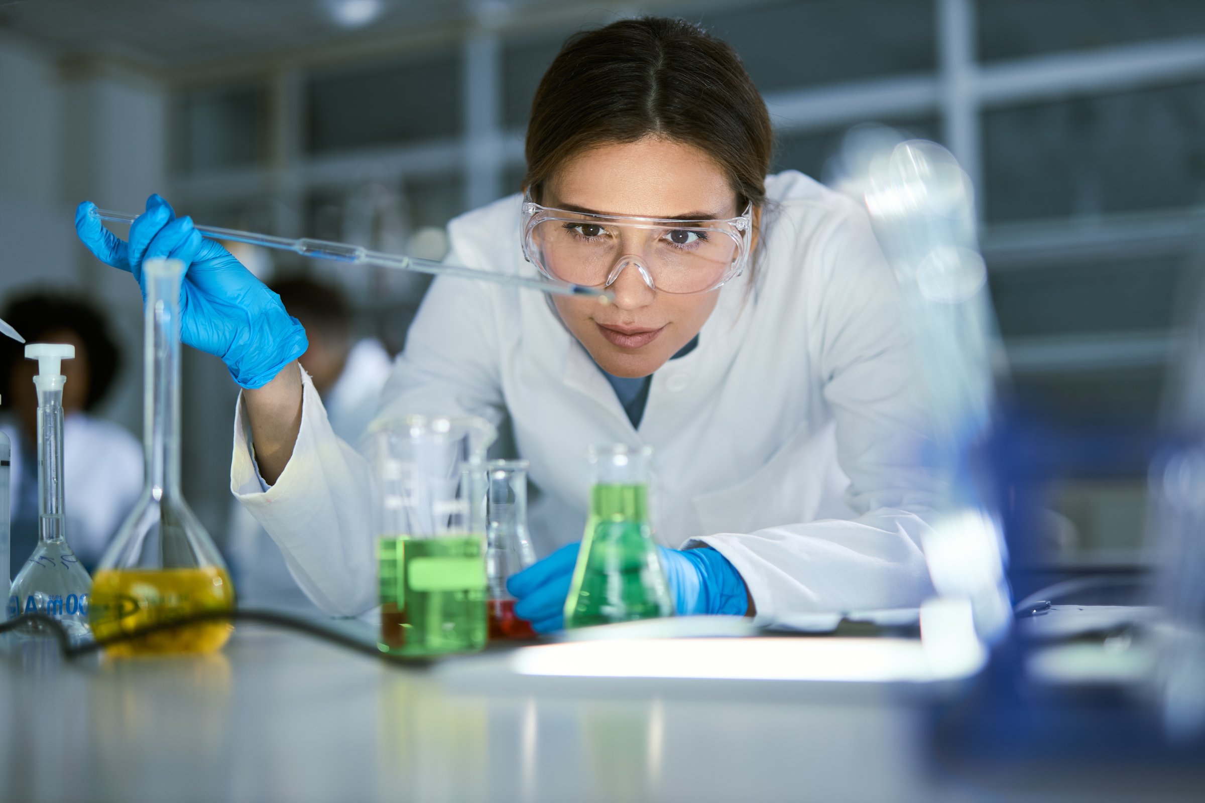 Female chemist working on medical research in laboratory